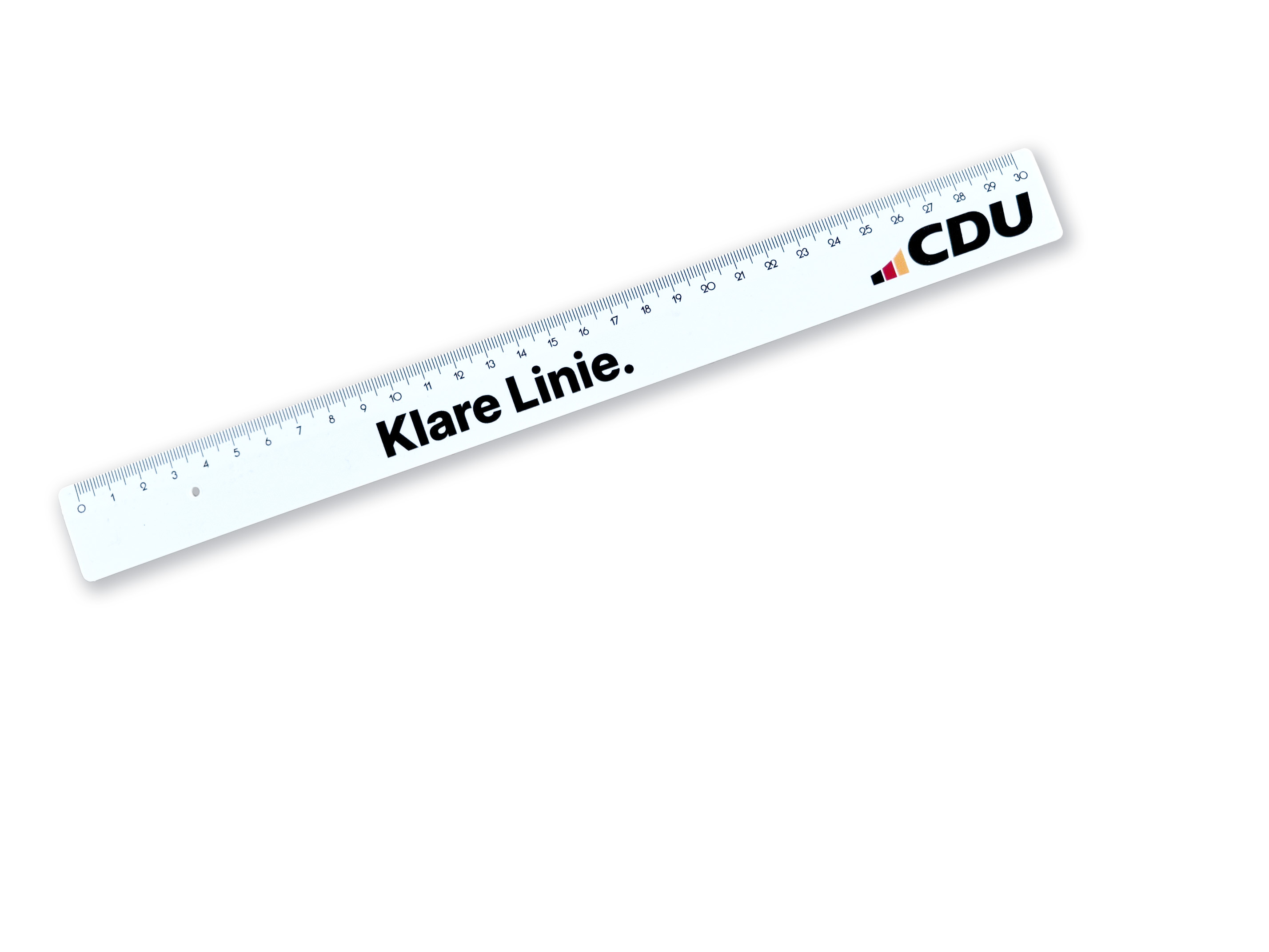 Weißes Lineal mit Aufdruck: Klare Linie. CDU