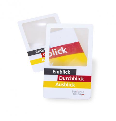 Kleine Leselupe aus Karton und Lupenfolie im Visitenkartenformat. Aufdruck: Einblick, Durchblick, Ausblick. Senioren-Union.