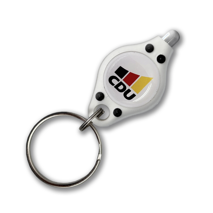 Kleine LED-Leuchte am Schlüsselring. Gehäuse weißer Kunststoff. Aufdruck: weißer Kreis mit 3-farbigem CDU-Logo.